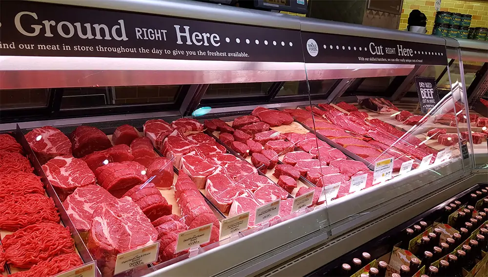 High CRI LED strip lighting installed above a fresh meat display counter