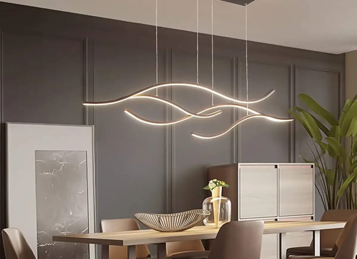 Suspended S-curve LED linear pendant light in a restaurant