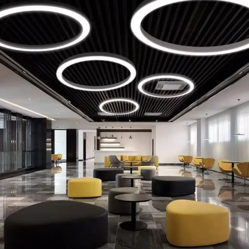 Ring LED pendant lights over a leisure salon seating area