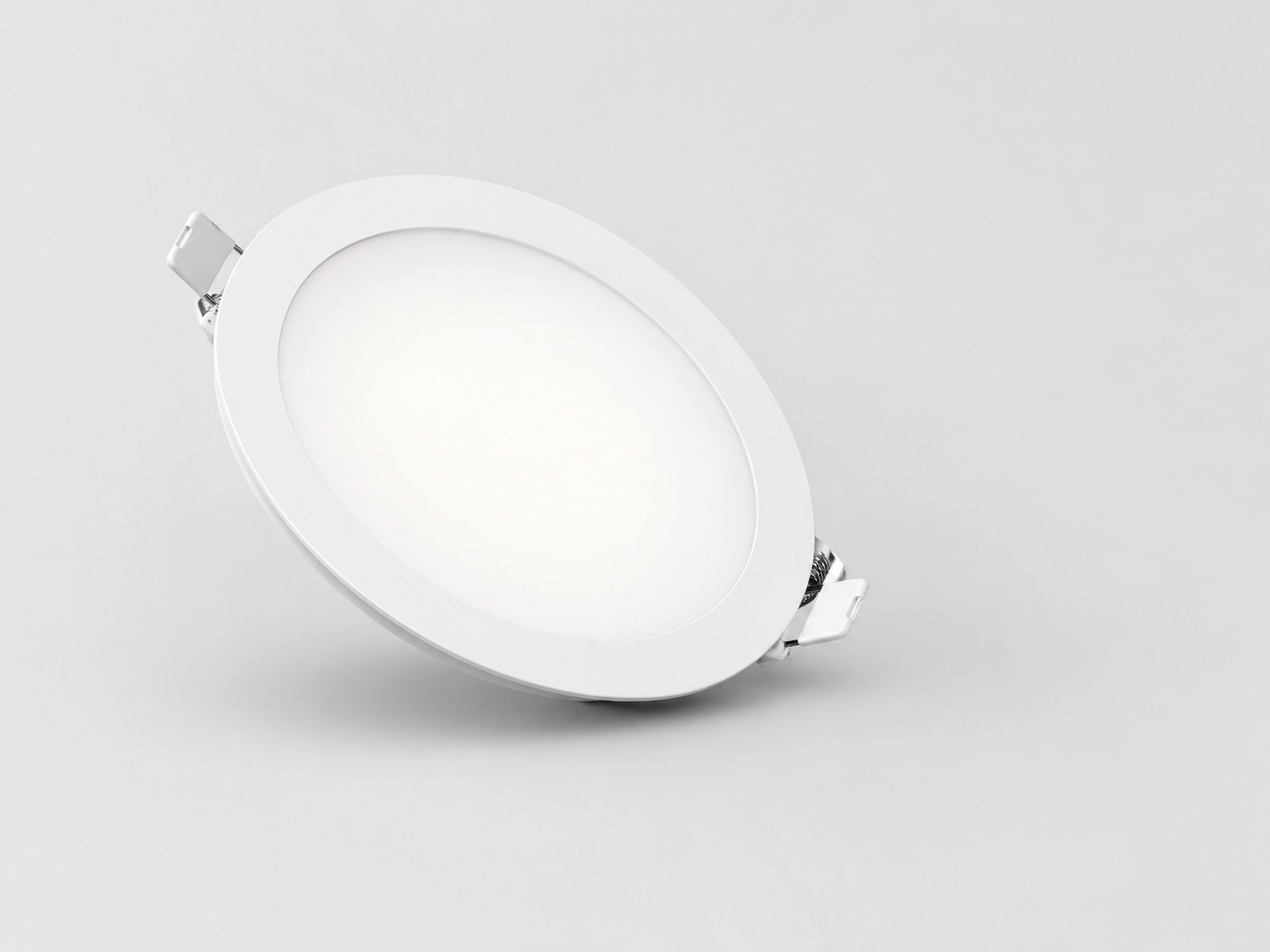 Slim recessed LED downlight with white trim and spring clips