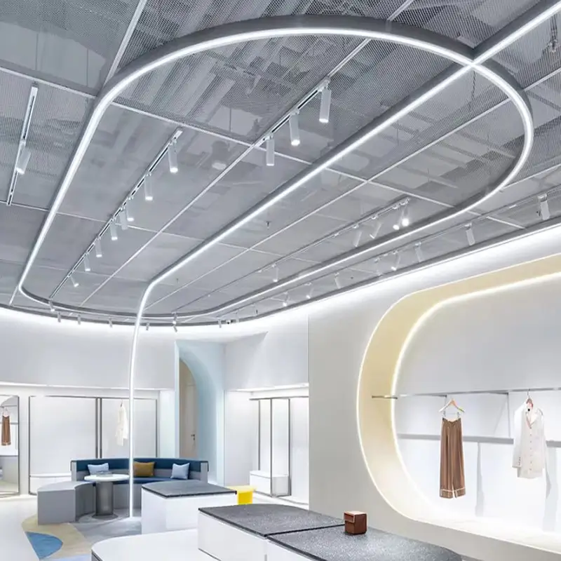 Suspended curved LED linear lights in a clothing store