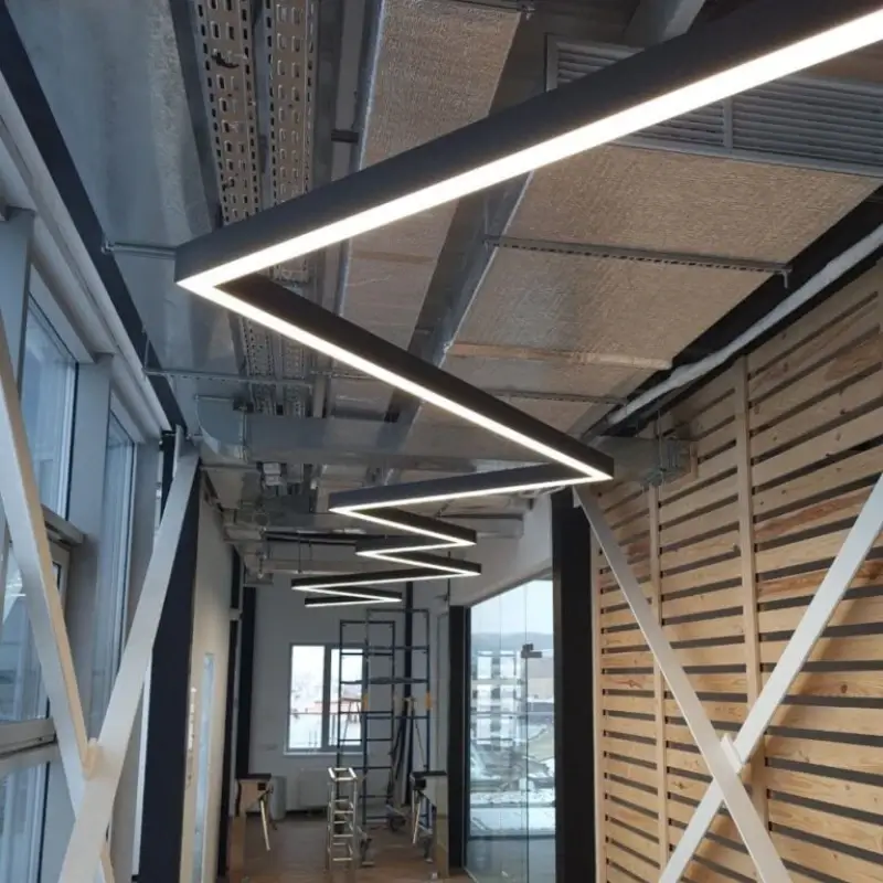 Zigzag shaped LED linear light along a corridor ceiling