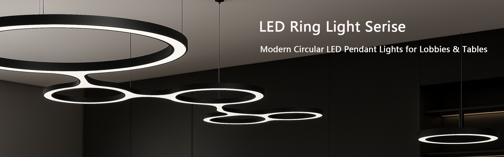 Circular ring LED pendant lights suspended in a hotel lobby