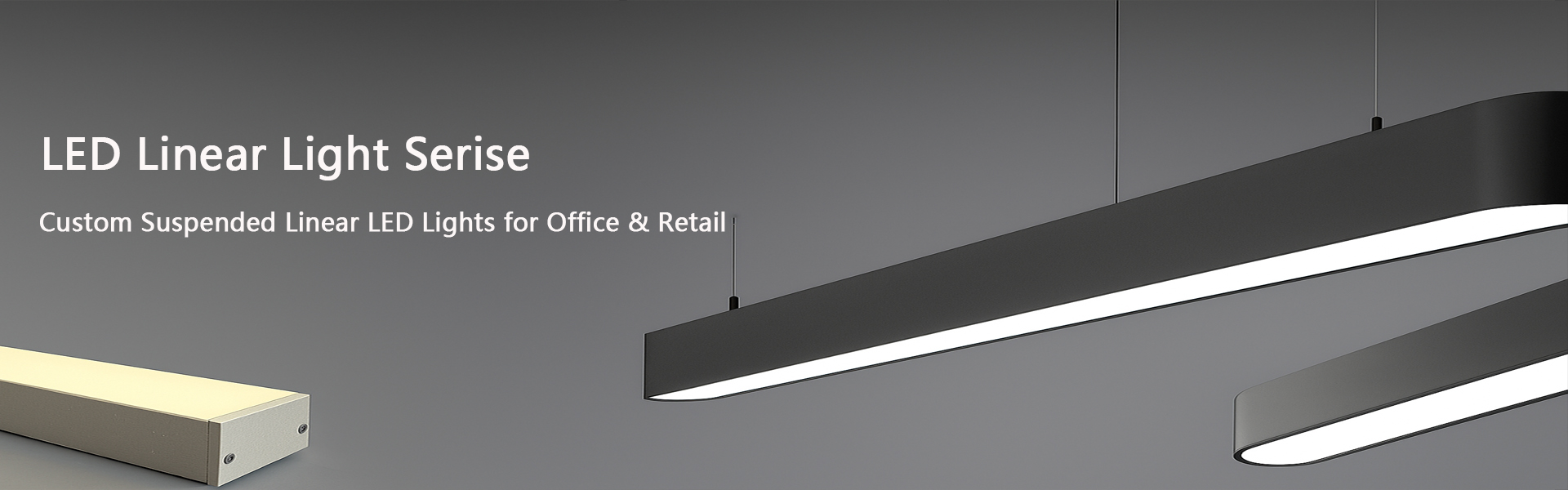 Straight suspended LED linear pendant light above an office workstation row