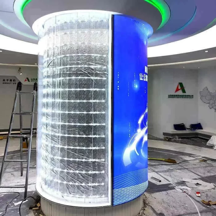 Round column fabric light box wrapping a circular pillar with a backlit graphic