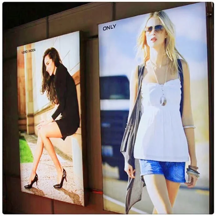 Backlit tension fabric light box illuminating a retail wall